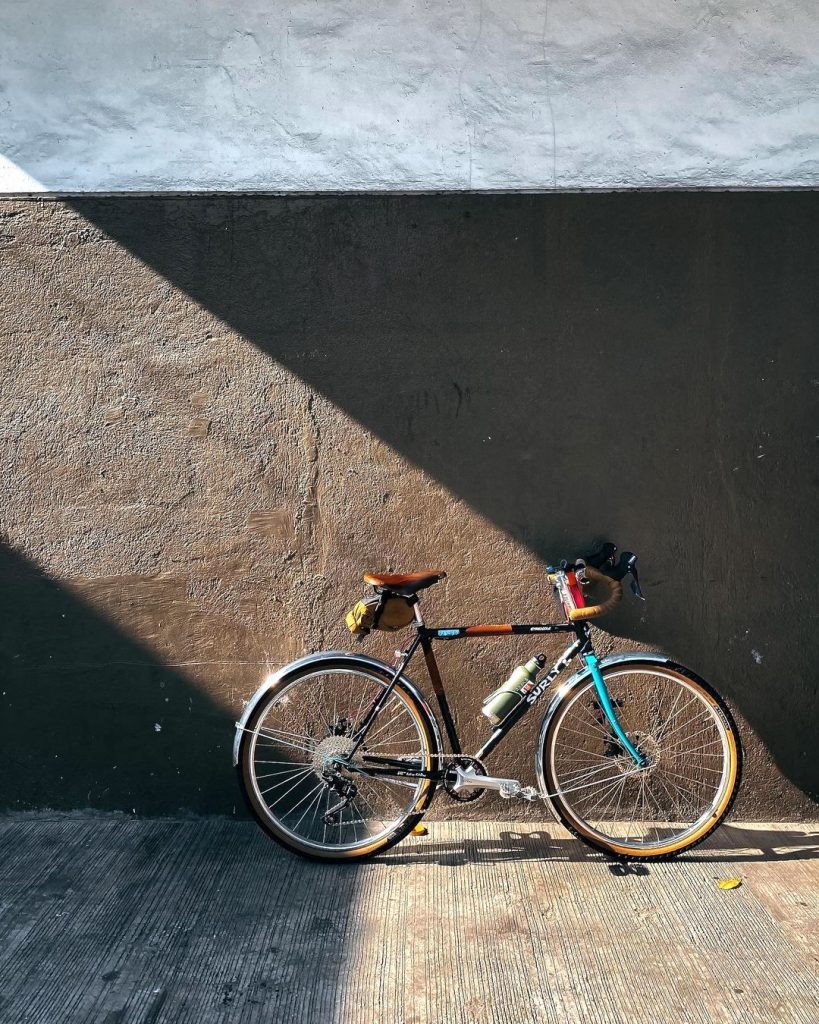 Jilson Tiu's transport of choice: the Surly Straggler awash in light as seen on his cycling Instagram